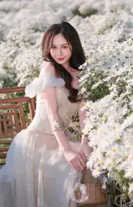 Enchanting Muse in White Chrysanthemum Field: A Portrait of Grace and Natural Beauty. - image 0