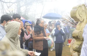 Spiritual Journey: Pilgrims Brave the Rain at Sacred Mountain Peaks to Collect Holy Water for Good Luck and Ancient Blessings - image 0