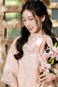 Poetic Beauty in Pink Ao Dai and White Lilies - image 0