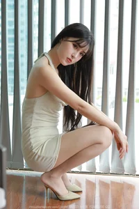 Chic Fashion Gallery: Xiaobao Features a Stunning Halter Neck Bodycon Dress in Latest IESS Collection - image 0