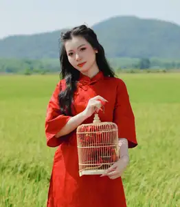 Discover the Serene Beauty: Vietnamese Girl in Red Ao Dai Amidst Green Rice Fields - image 0