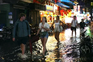 Exploring Ho Chi Minh City in the Rain: Locals and Tourists Embrace the Weekend Despite Stormy Weather - image 18