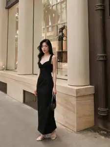 Elegant Black Dress: Modern Muse Captivating All Eyes on the Street - image 1