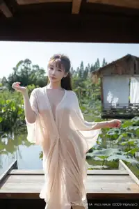 Discover Lu Xuan Xuan's Graceful Beauty in a White Dress Amidst a Serene Lotus Pond - XiuRen No.10630 - image 0